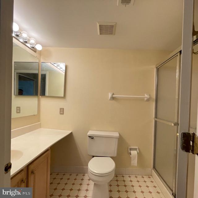 2015 Welsh Road, Unit A24 Philadelphia, PA 19115 - Photo 23 of 29 a bathroom with a sink a toilet a mirror and shower