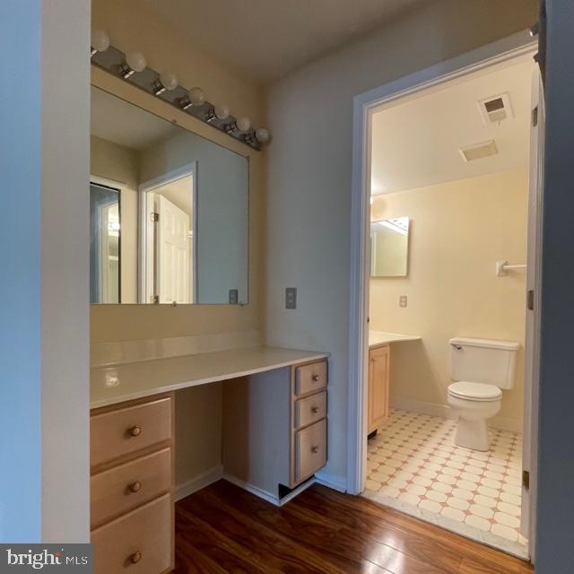 2015 Welsh Road, Unit A24 Philadelphia, PA 19115 - Photo 24 of 29 a bathroom with a toilet a sink and a mirror
