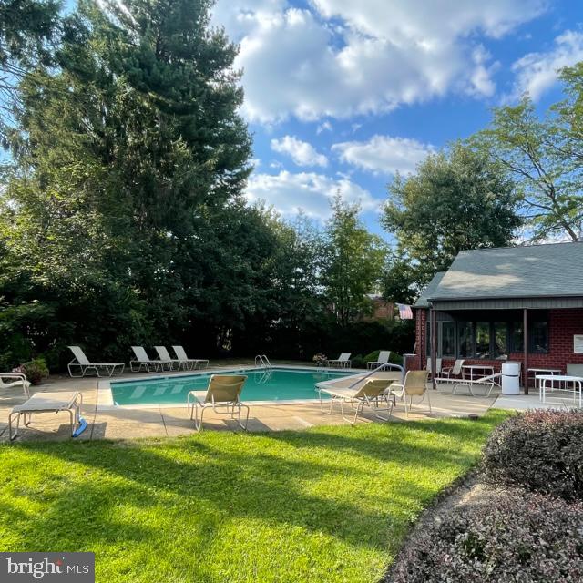 2015 Welsh Road, Unit A24 Philadelphia, PA 19115 - Photo 29 of 29 a view of a swimming pool with a table and chairs