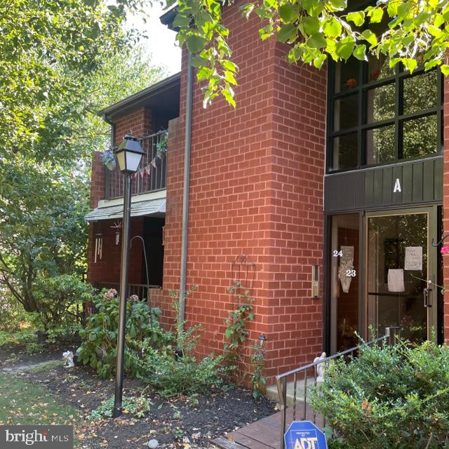 2015 Welsh Road, Unit A24 Philadelphia, PA 19115 - Photo 3 of 29 a brick building with a tree in front of it