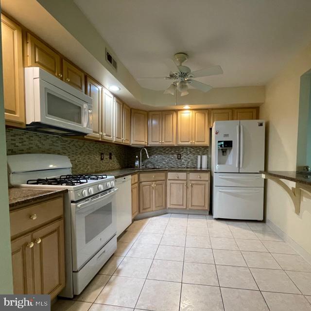 2015 Welsh Road, Unit A24 Philadelphia, PA 19115 - Photo 8 of 29 a kitchen with stainless steel appliances granite countertop a stove a sink and a refrigerator
