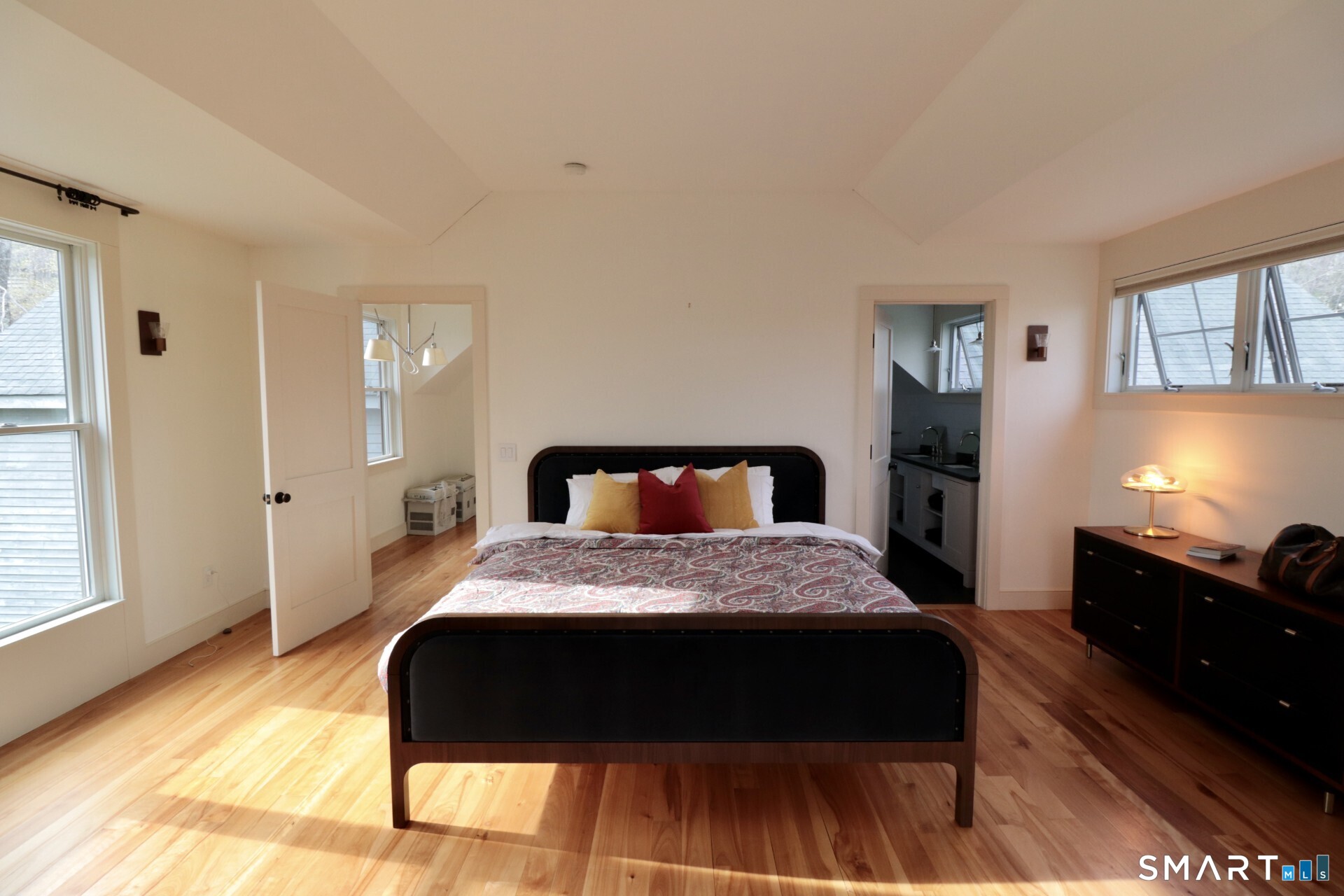 68 Hopkins Road Warren, CT 06777 - Photo 13 of 30 a bedroom with a bed and wooden floor