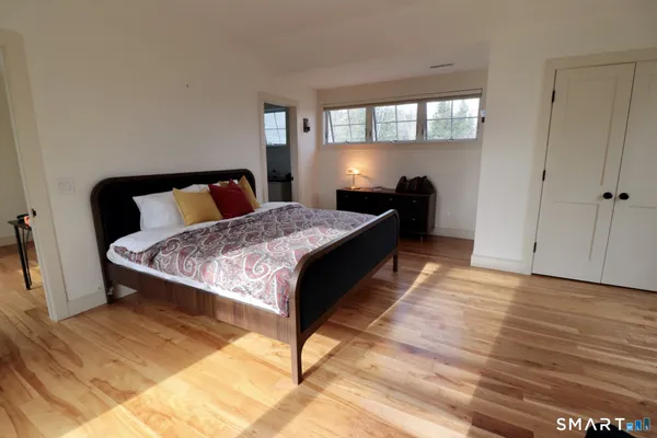 a bed room with a bed and a window