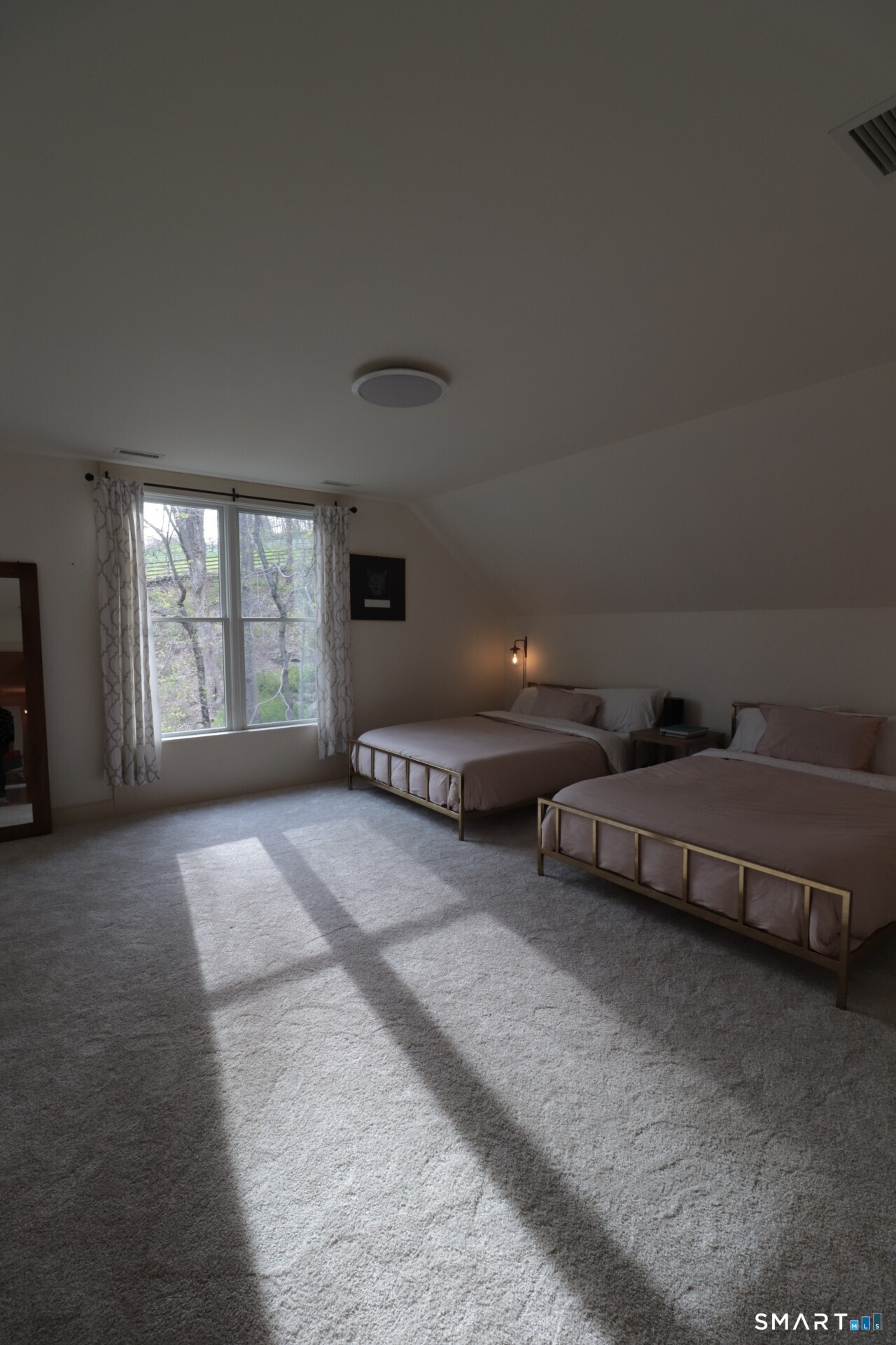 68 Hopkins Road Warren, CT 06777 - Photo 19 of 30 a spacious bedroom with two beds and a window