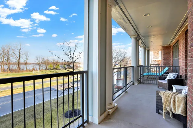 a view of living room with furniture and floor to ceiling window