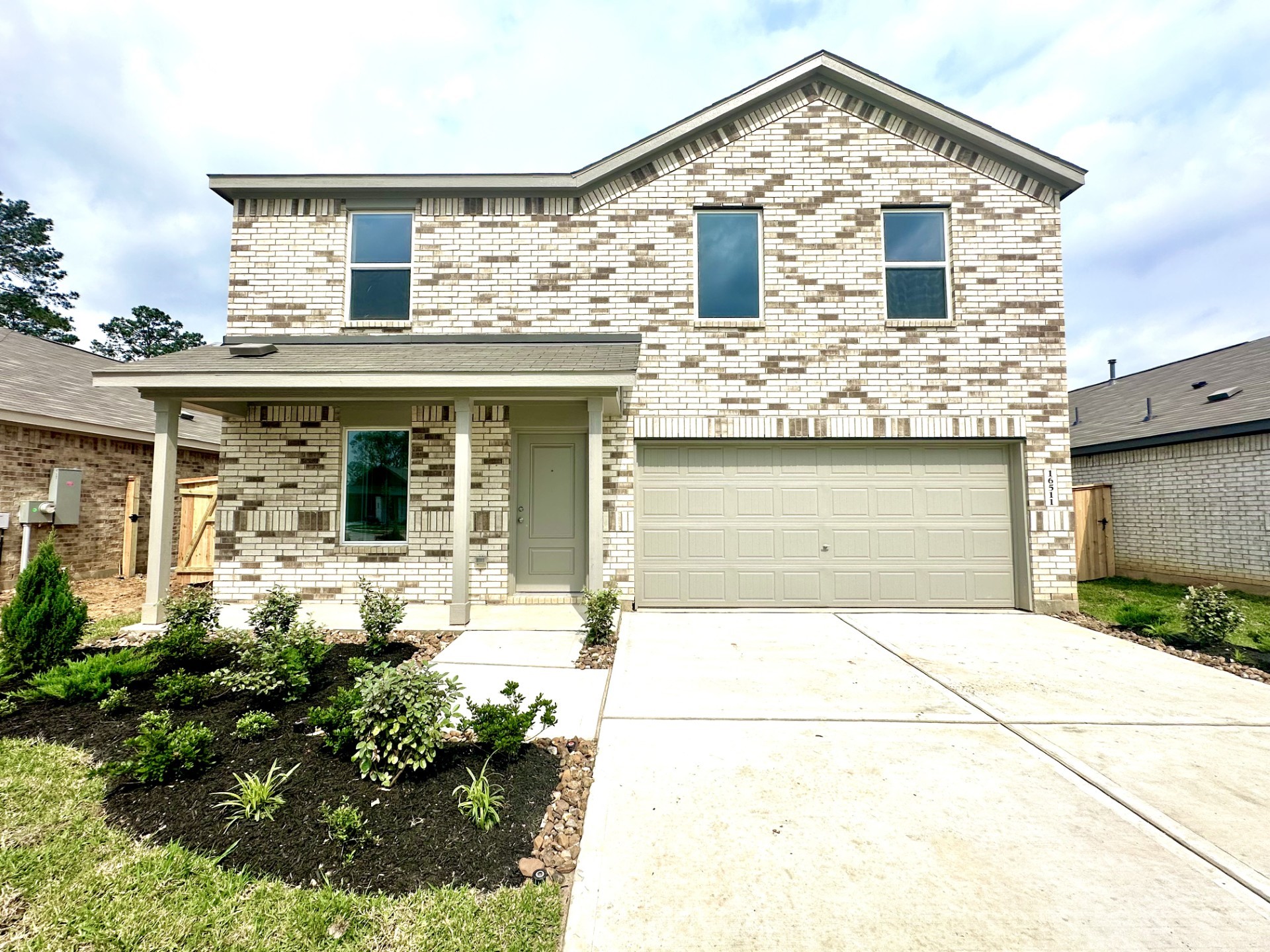 a front view of a house with yard