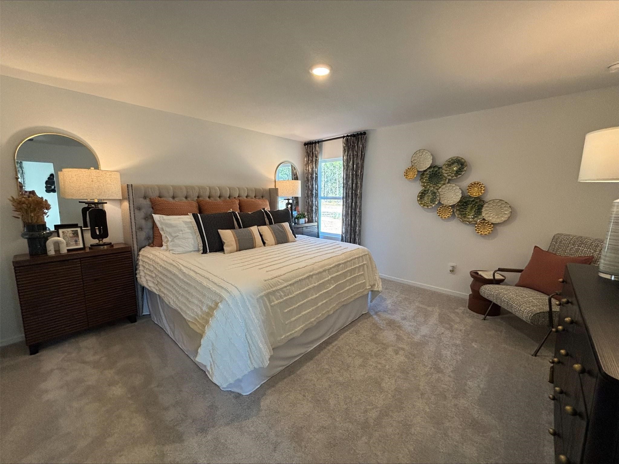 16511 Ithaca Pheasant Drive New Caney, TX 77357 - Photo 30 of 31 a spacious bedroom with a bed and a lamp with window