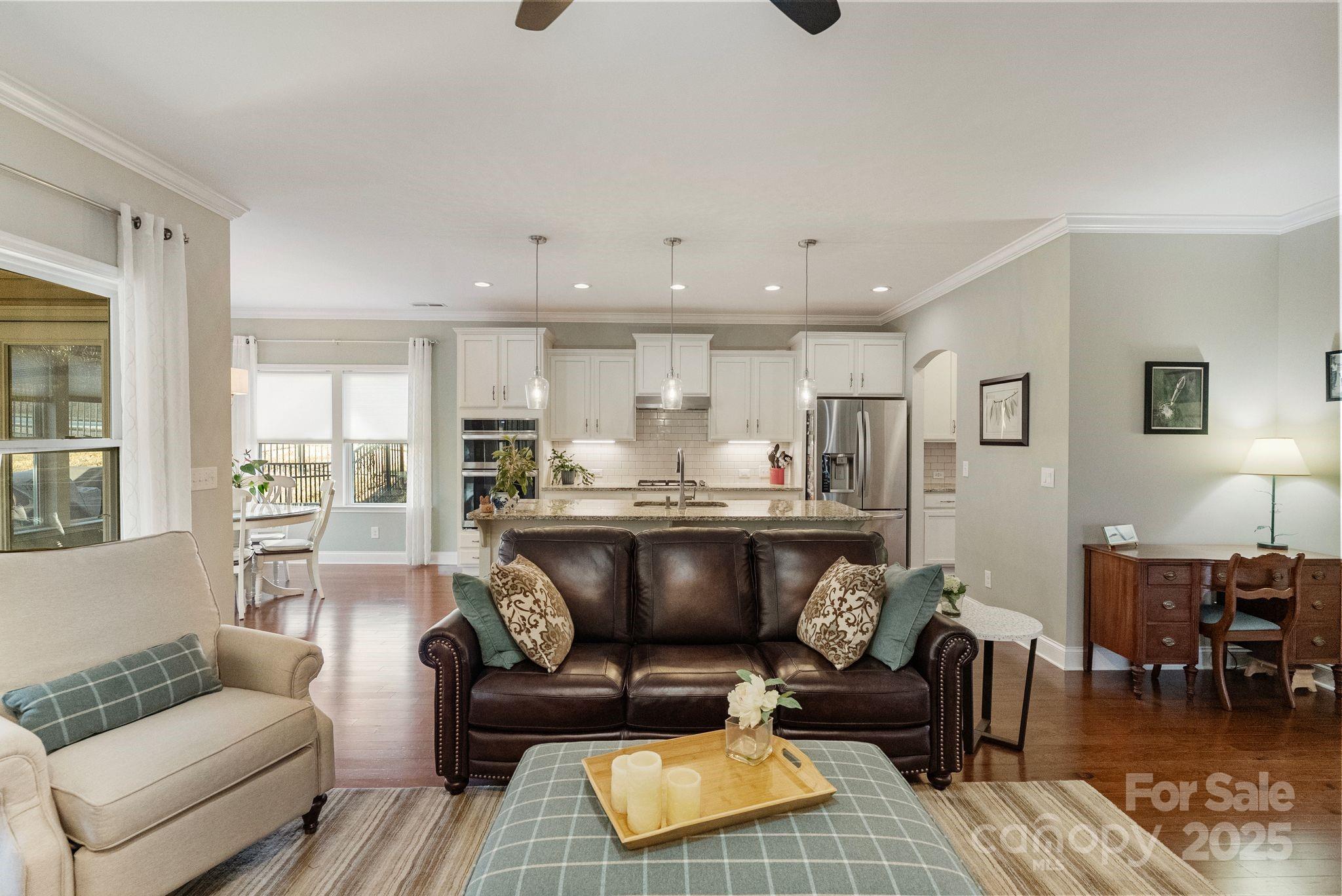 2304 Celandine Way Tega Cay, SC 29708 - Photo 11 of 47 a living room with furniture and kitchen view