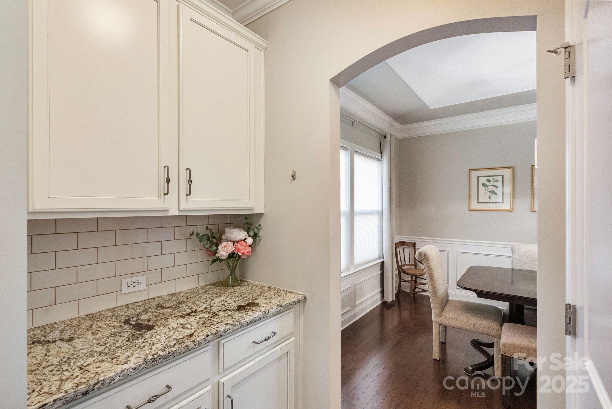 2304 Celandine Way Tega Cay, SC 29708 - Photo 16 of 47 a kitchen with a sink and cabinets