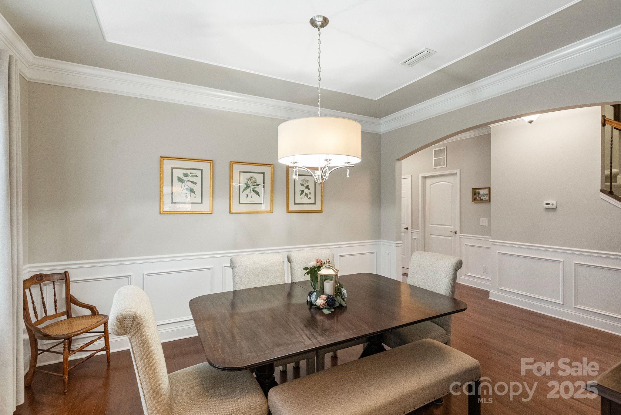 2304 Celandine Way Tega Cay, SC 29708 - Photo 17 of 47 a view of a dining room with furniture and wooden floor