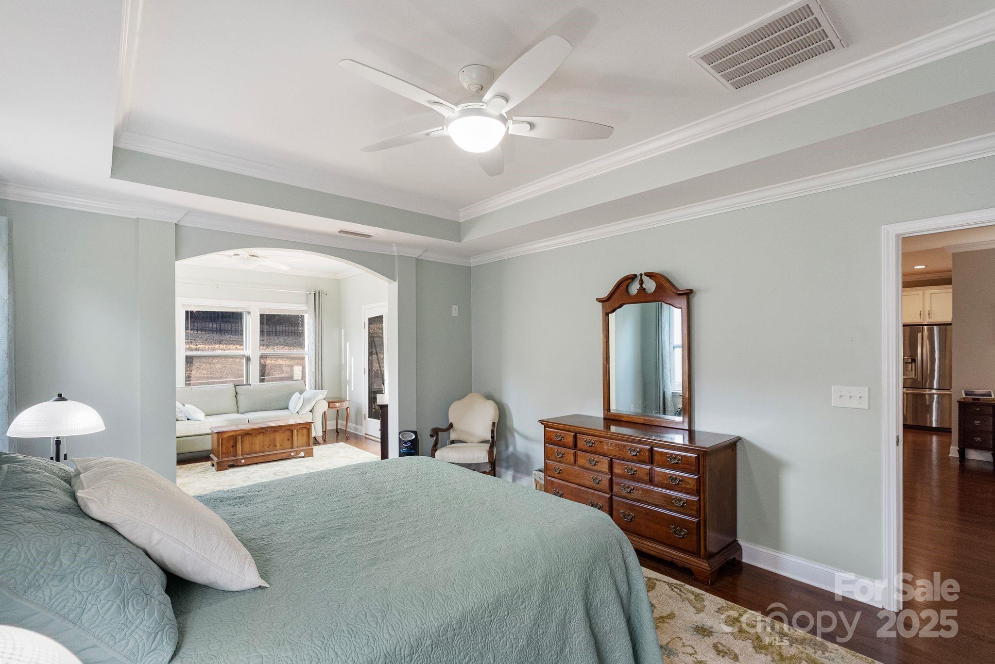 2304 Celandine Way Tega Cay, SC 29708 - Photo 18 of 47 a bedroom with a bed and a large window