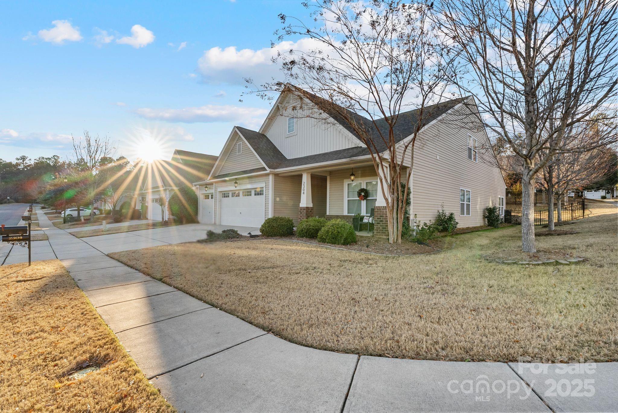 2304 Celandine Way Tega Cay, SC 29708 - Photo 2 of 47 a view of a house with a yard