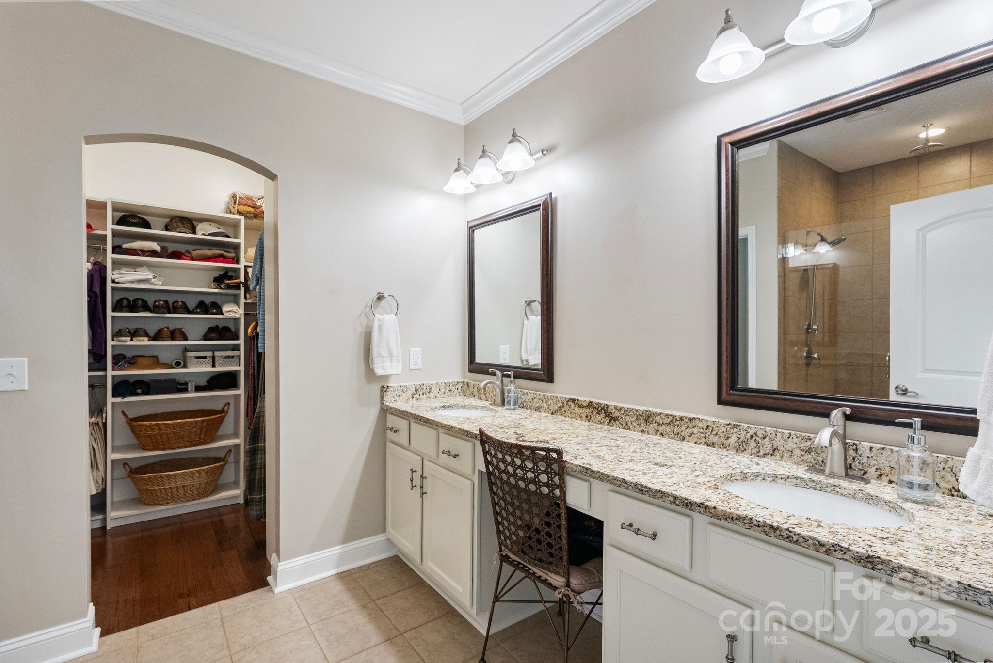2304 Celandine Way Tega Cay, SC 29708 - Photo 22 of 47 a bathroom with a granite countertop sink and a mirror