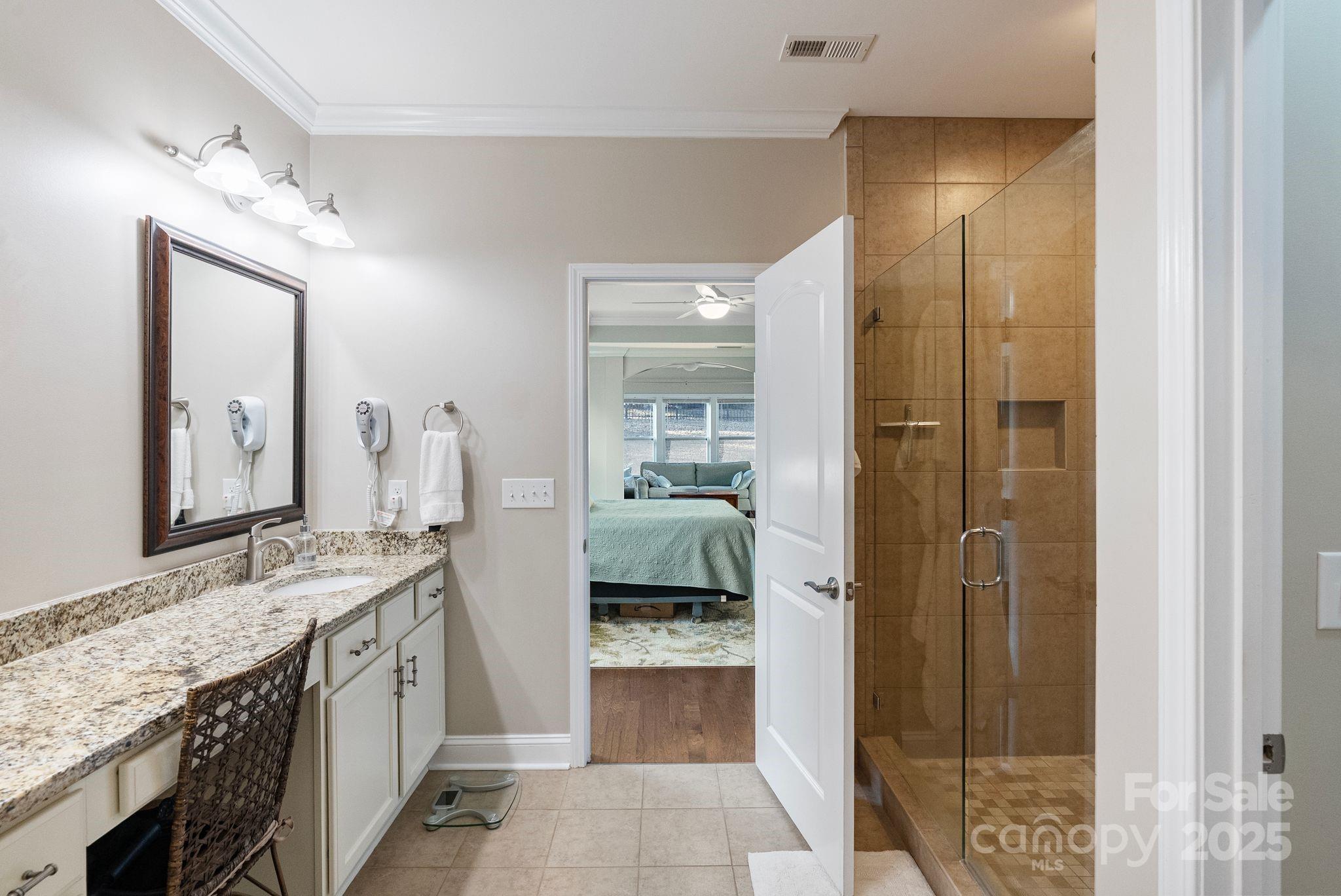 2304 Celandine Way Tega Cay, SC 29708 - Photo 23 of 47 a bathroom with a granite countertop sink and a mirror