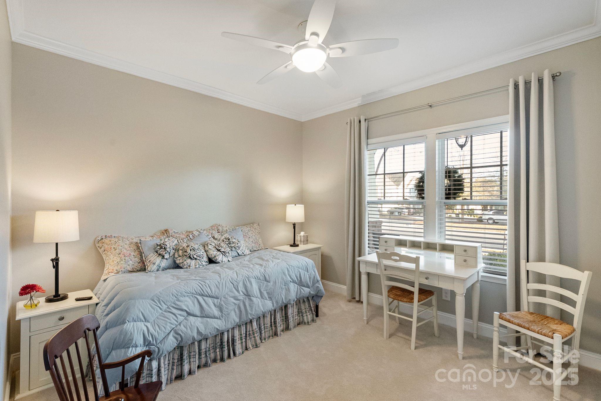 2304 Celandine Way Tega Cay, SC 29708 - Photo 26 of 47 a bedroom with a bed and a table with chair