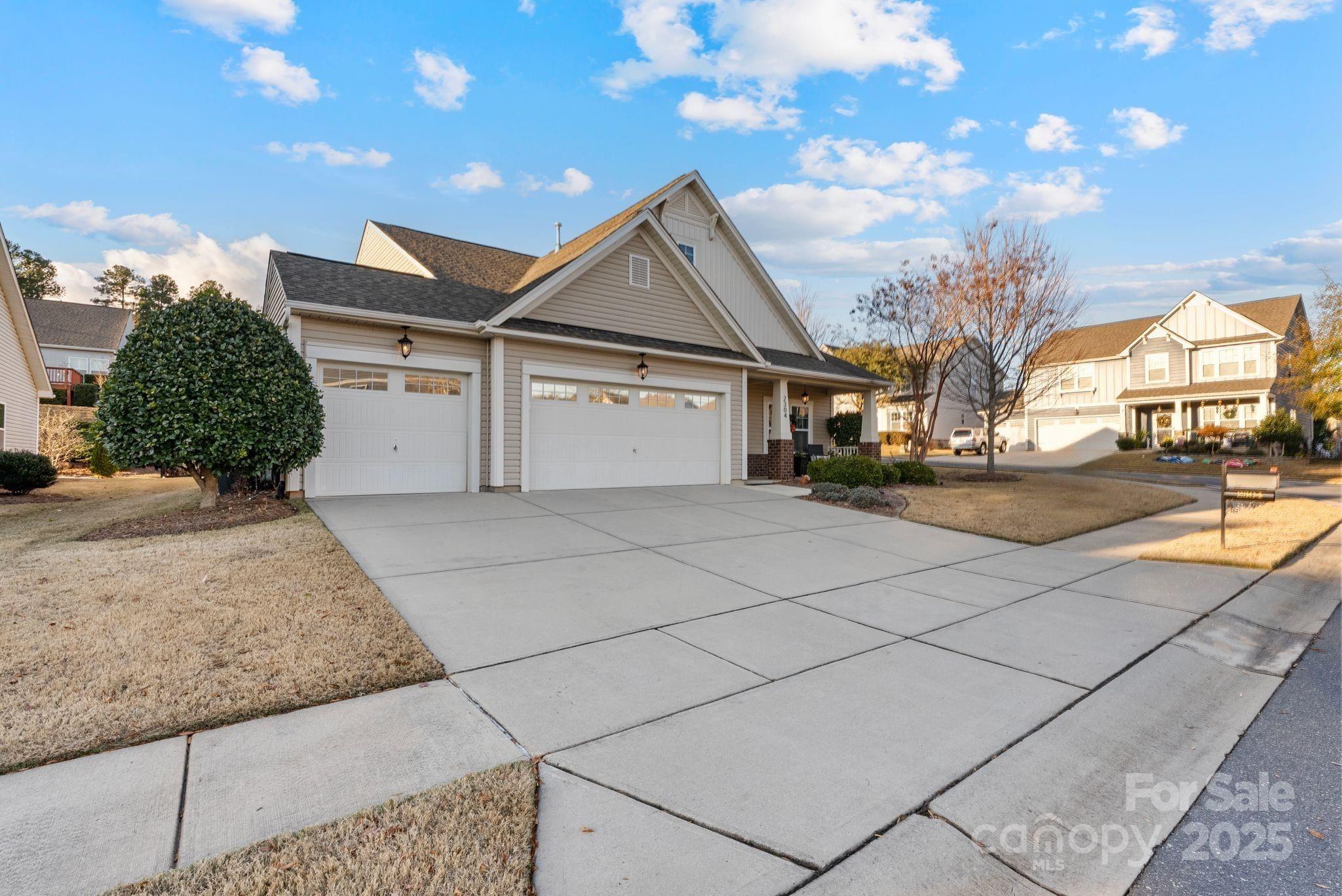 2304 Celandine Way Tega Cay, SC 29708 - Photo 3 of 47 a view of a house with a street