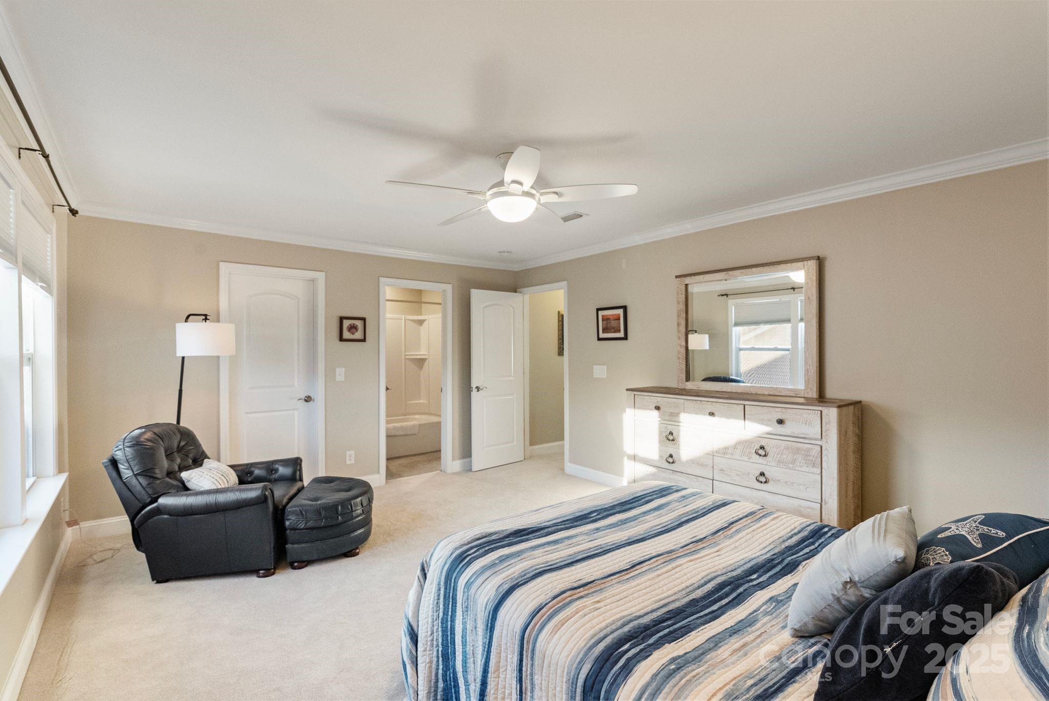 2304 Celandine Way Tega Cay, SC 29708 - Photo 32 of 47 a bedroom with bed couch and window
