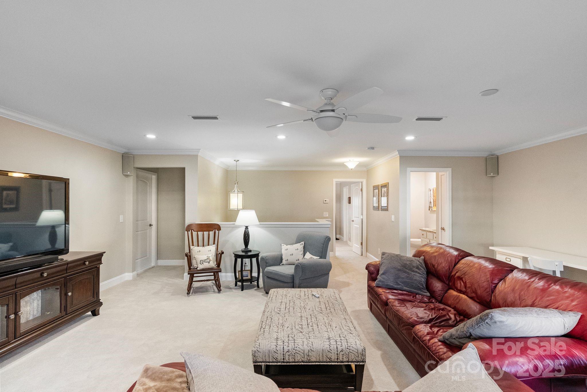 2304 Celandine Way Tega Cay, SC 29708 - Photo 33 of 47 a living room with furniture and a flat screen tv