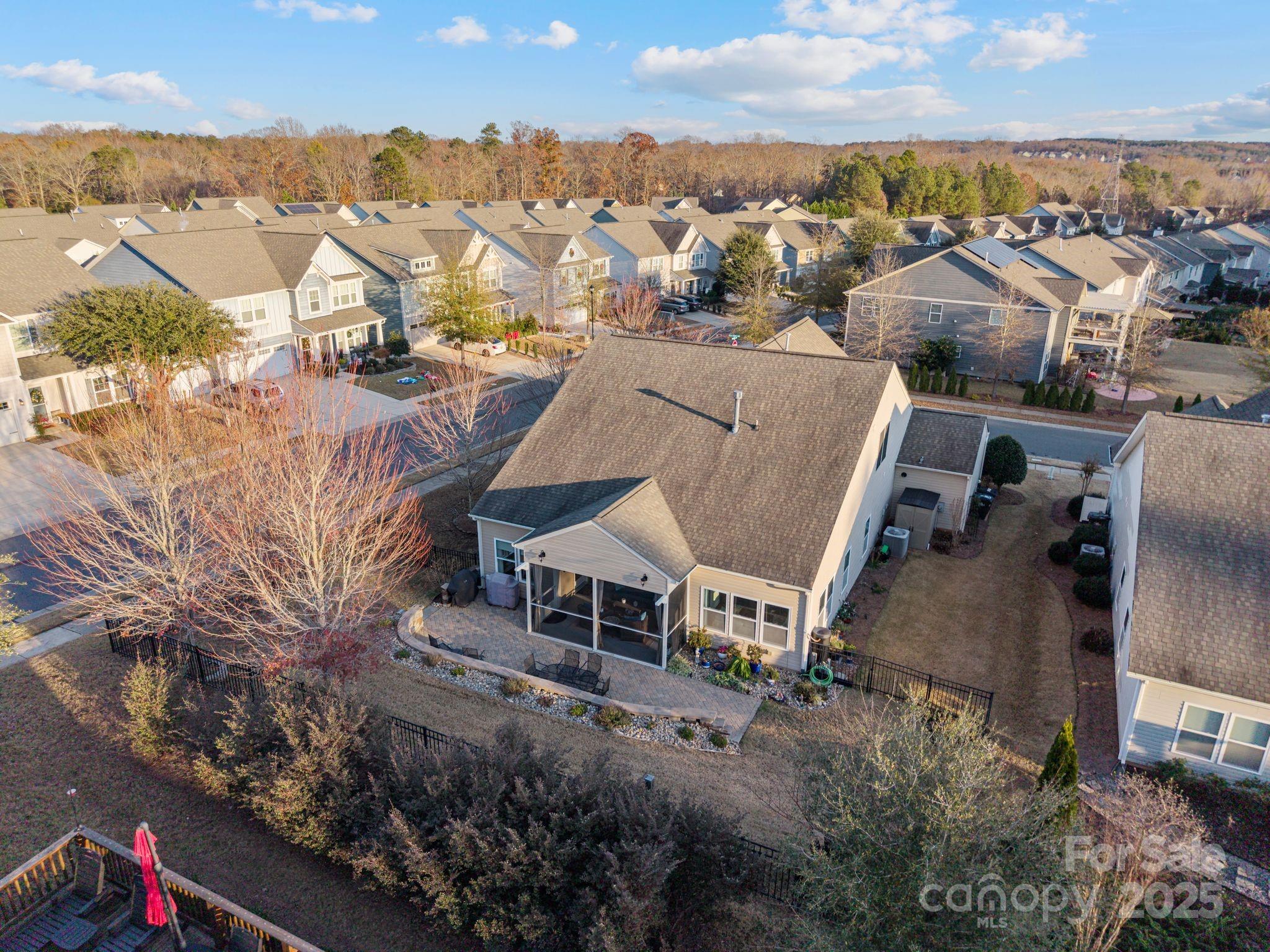 2304 Celandine Way Tega Cay, SC 29708 - Photo 41 of 47 an aerial view of a house with a yard and mountain view in back