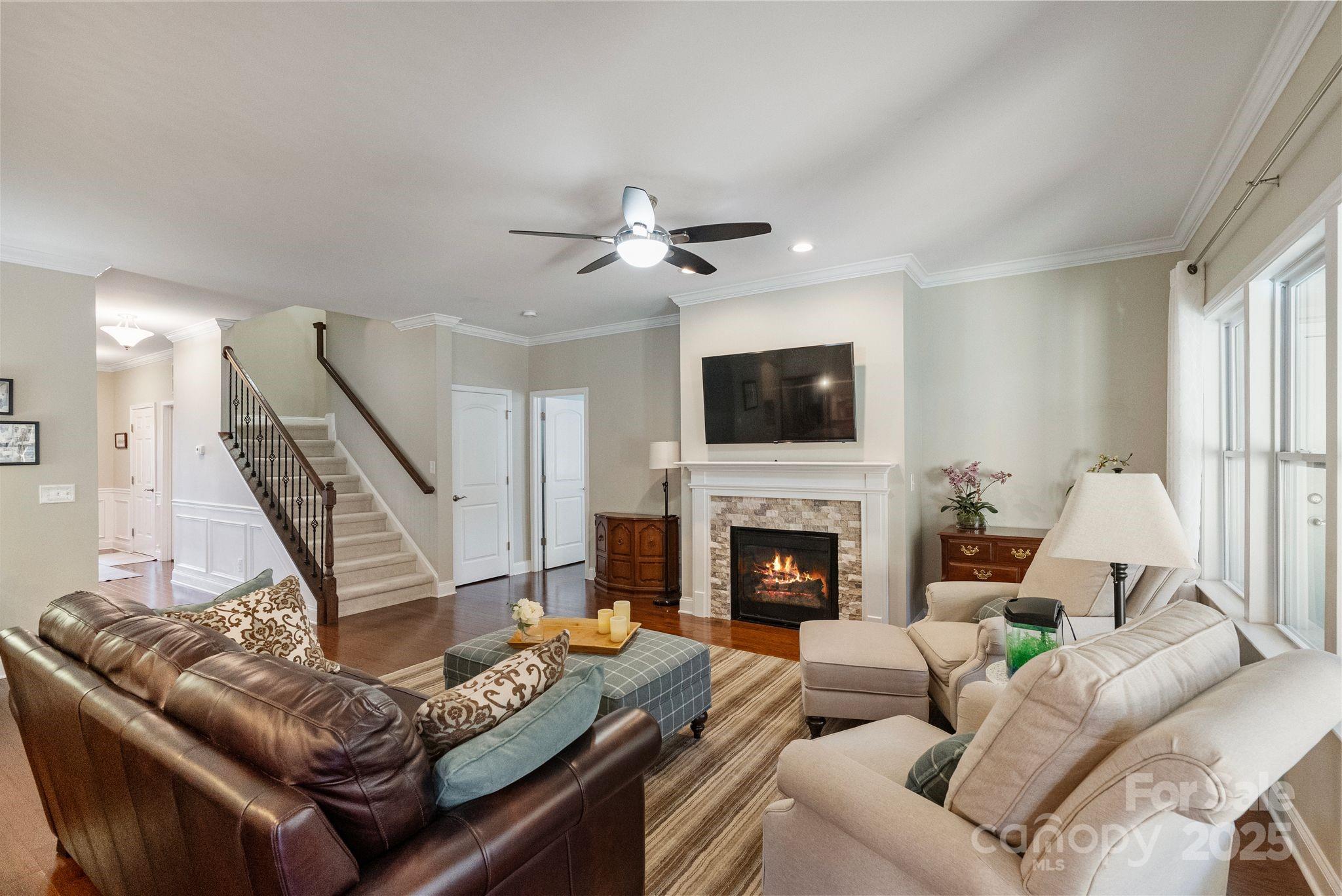 2304 Celandine Way Tega Cay, SC 29708 - Photo 10 of 47 a living room with furniture and a fireplace