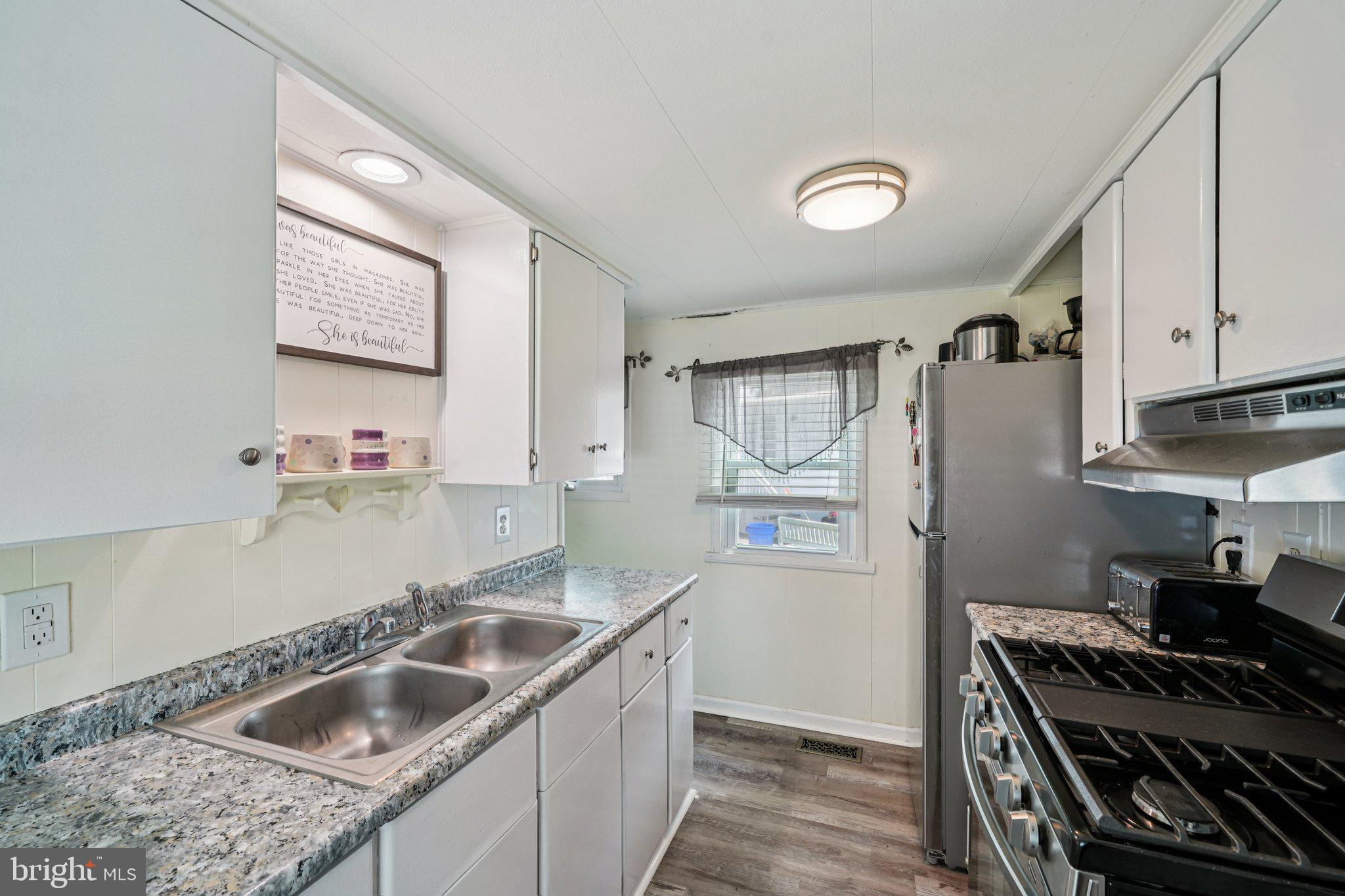 2528 Tilton Road, Unit 421 Egg Harbor Township, NJ 08234 - Photo 12 of 31 a kitchen that has a sink and a stove