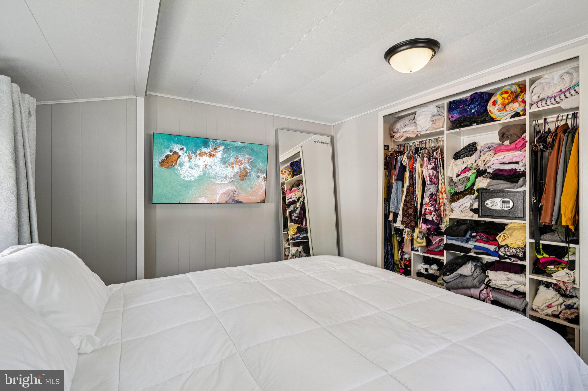 2528 Tilton Road, Unit 421 Egg Harbor Township, NJ 08234 - Photo 19 of 31 a bedroom with a bed and a walk in closet