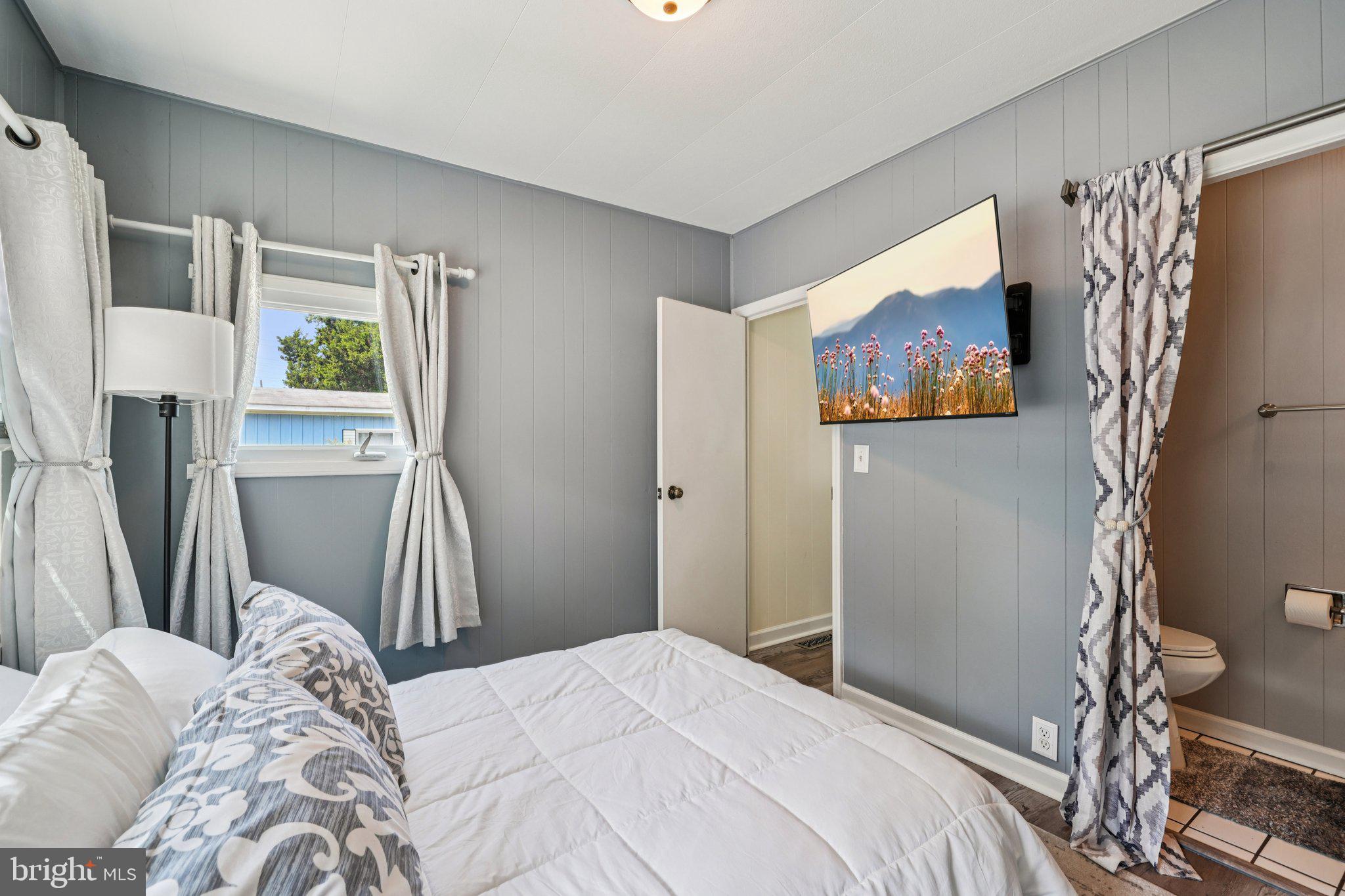 2528 Tilton Road, Unit 421 Egg Harbor Township, NJ 08234 - Photo 26 of 31 a bedroom with a bed and a window