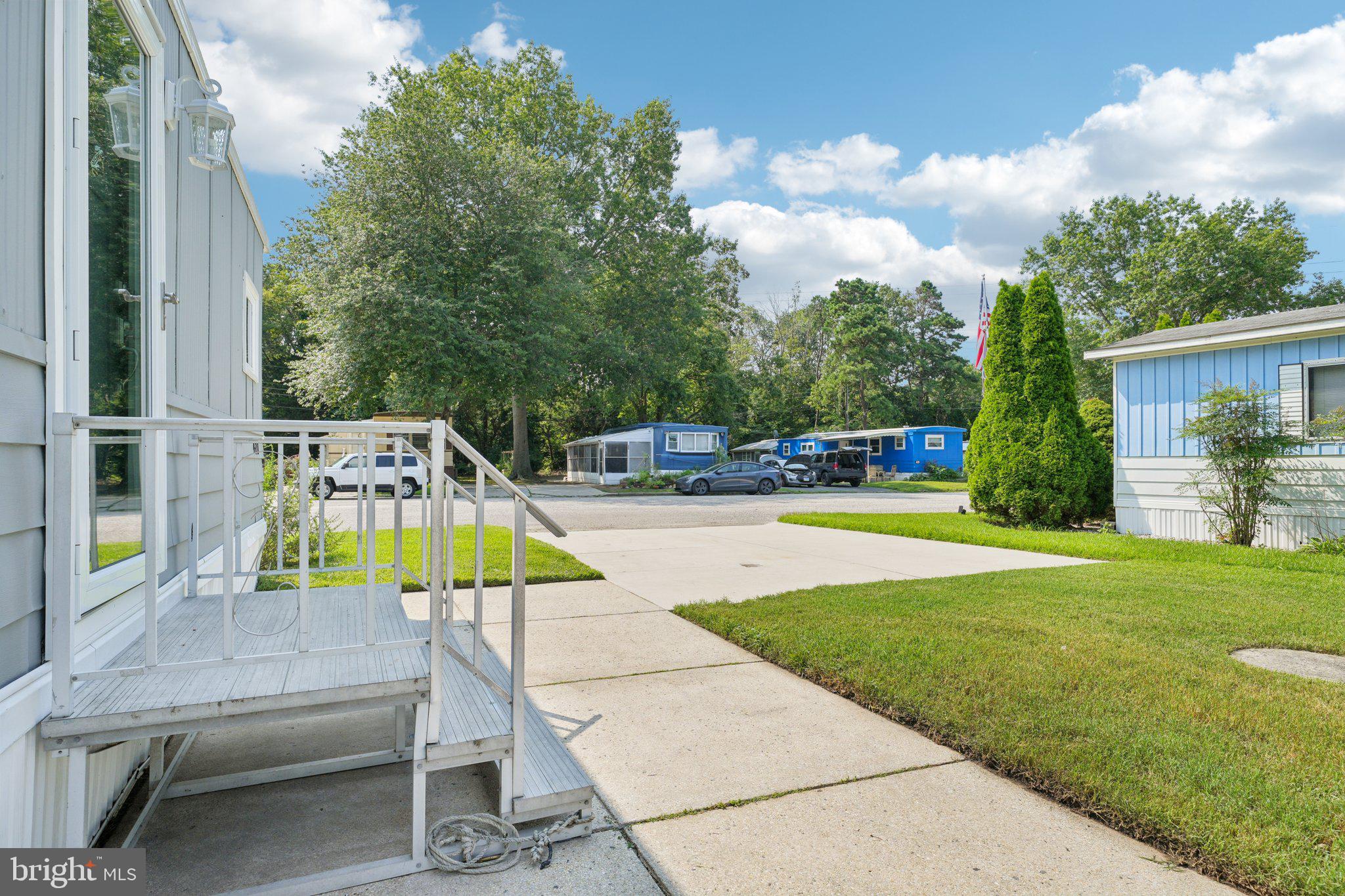 2528 Tilton Road, Unit 421 Egg Harbor Township, NJ 08234 - Photo 5 of 31 a view of backyard with swimming pool and seating space