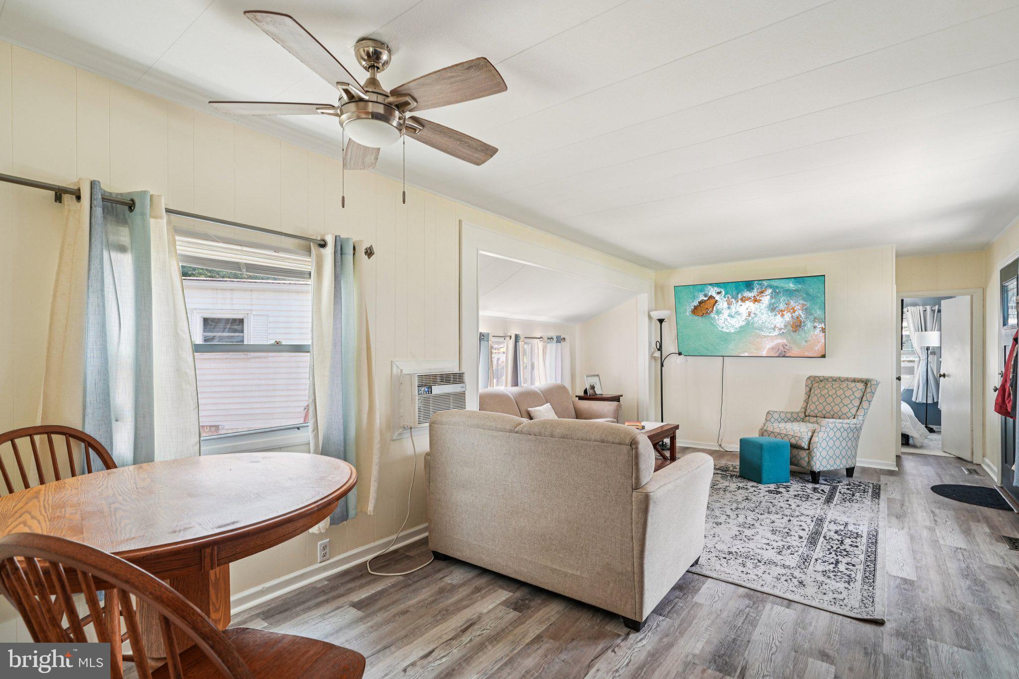 2528 Tilton Road, Unit 421 Egg Harbor Township, NJ 08234 - Photo 6 of 31 a living room with furniture and a table