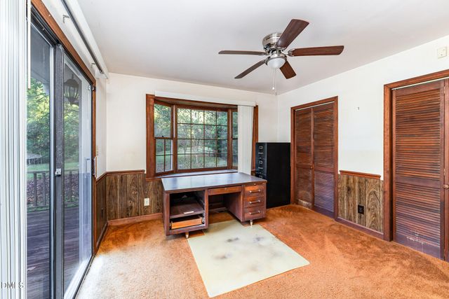 a kitchen with a sink cabinets and window