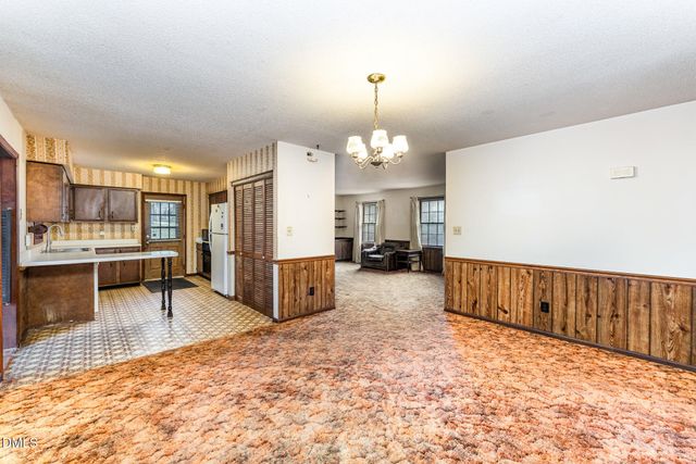 a living room with furniture window and a fireplace