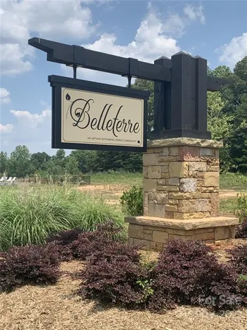 a view of outdoor space with garden and trees