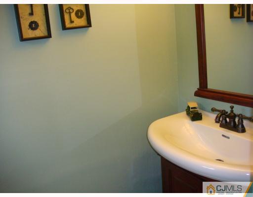 14 Purdue Road Old Bridge, NJ 08859 - Photo 7 of 9 a bathroom with a sink and a mirror
