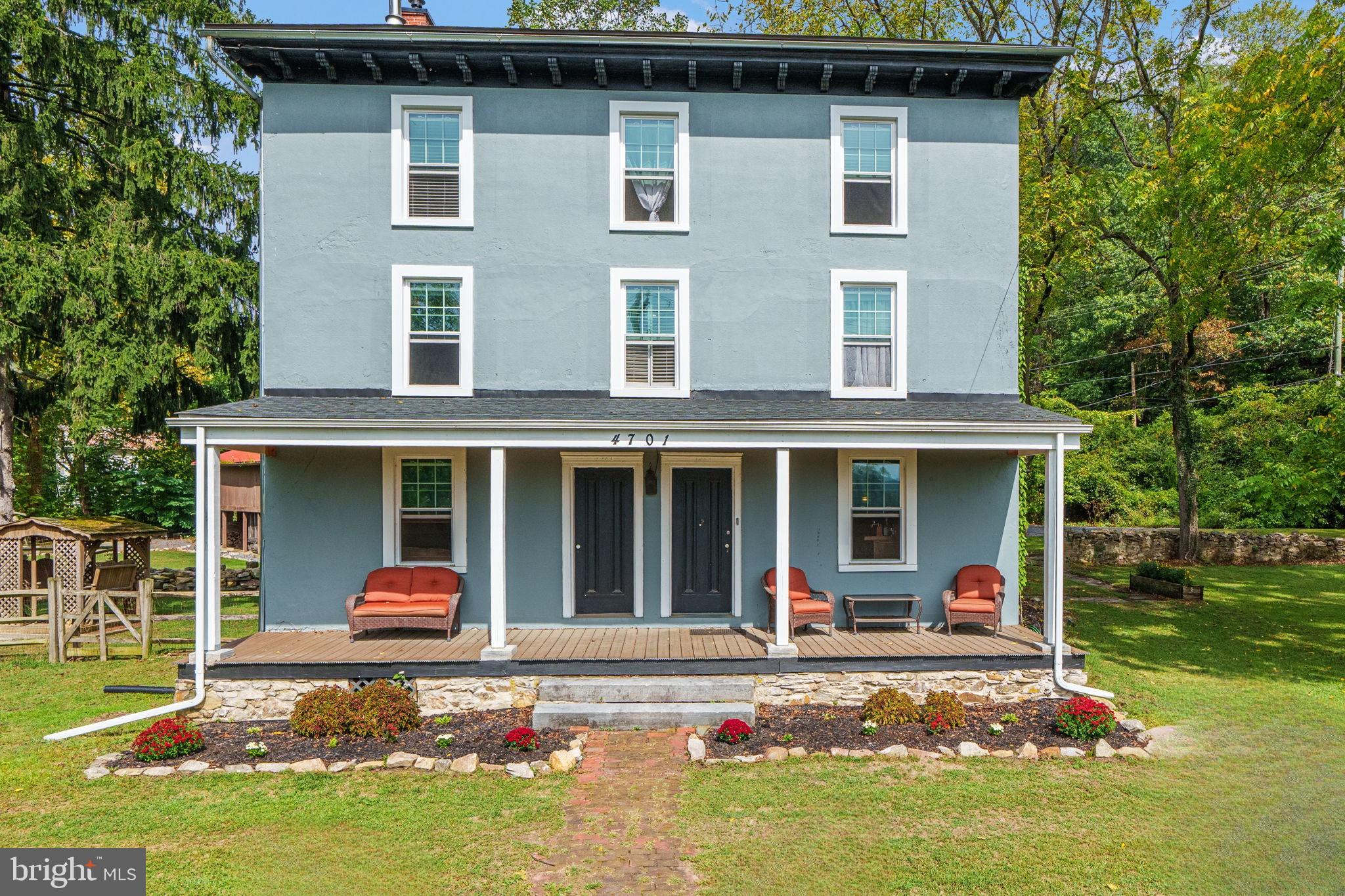 4701 Edges Mill Road Downingtown, PA 19335 - Photo 2 of 74 a front view of a house with a yard