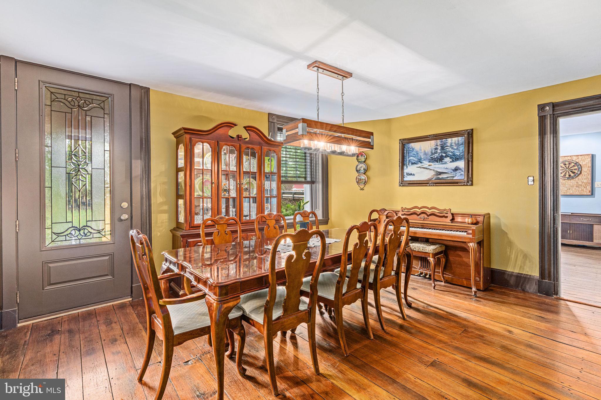 4701 Edges Mill Road Downingtown, PA 19335 - Photo 21 of 74 a view of a dining room with furniture window and wooden floor