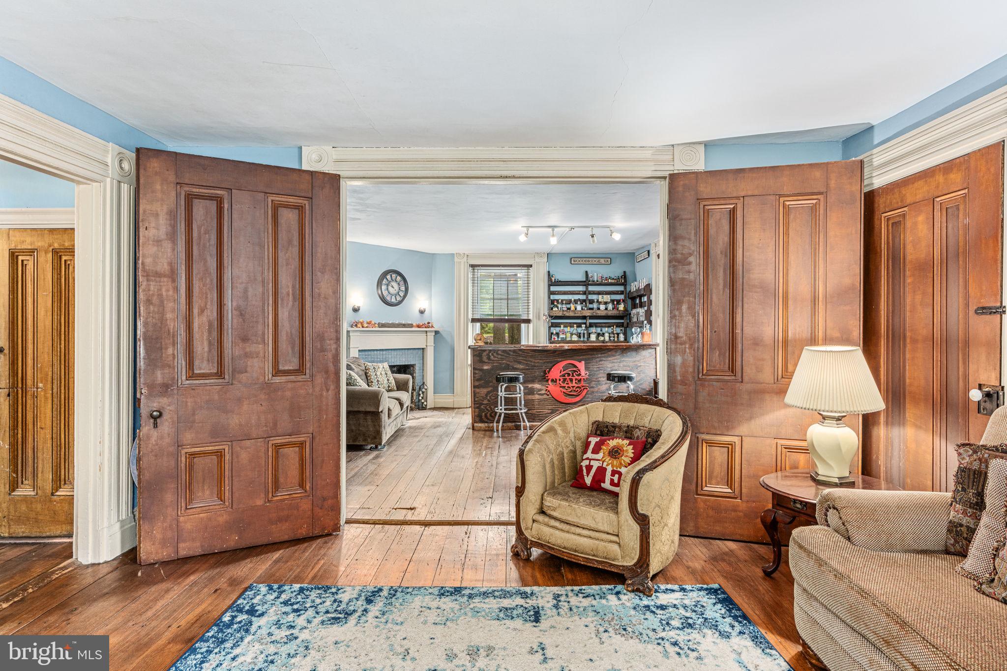 4701 Edges Mill Road Downingtown, PA 19335 - Photo 30 of 74 a living room with furniture and a fireplace