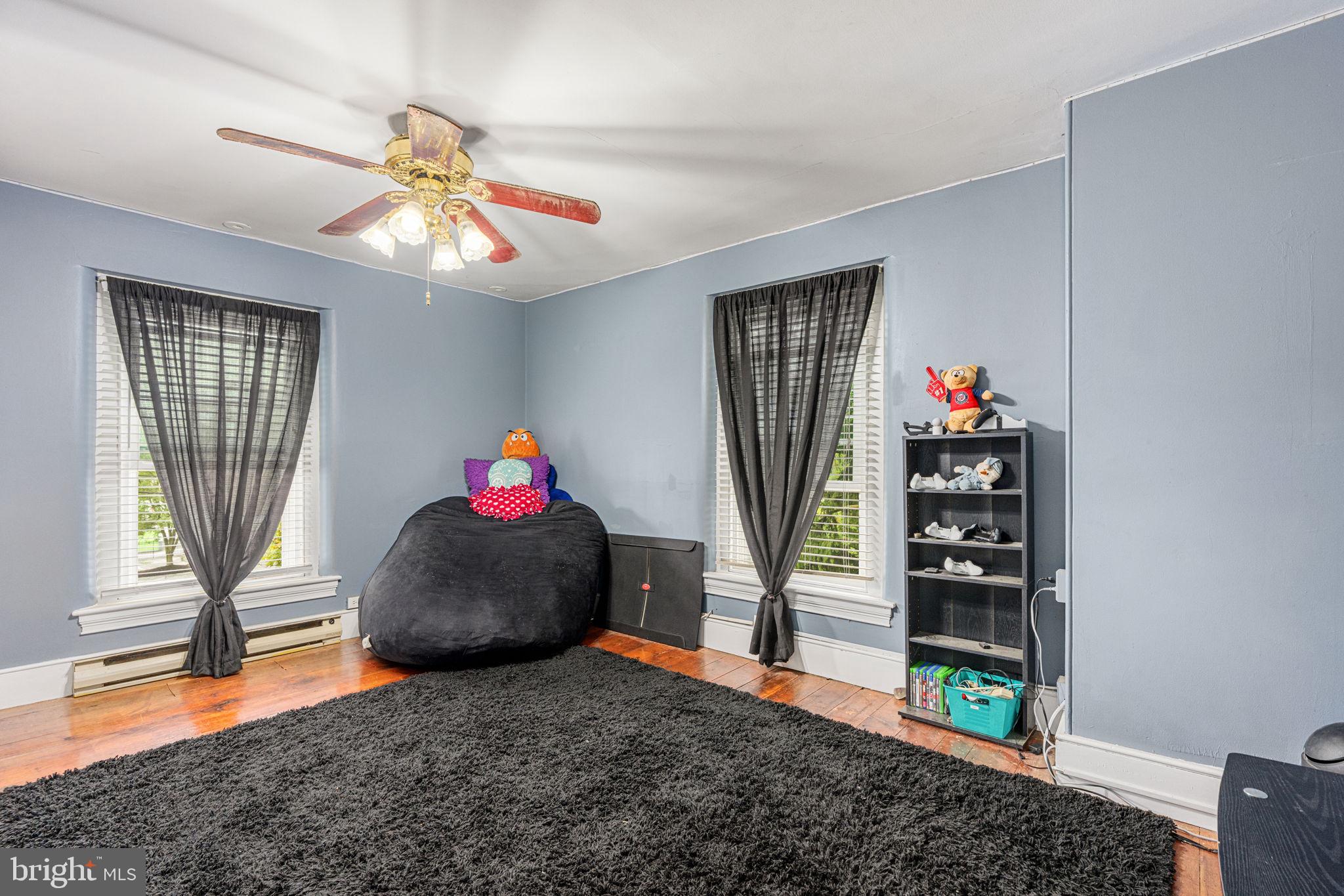 4701 Edges Mill Road Downingtown, PA 19335 - Photo 51 of 74 a living room with furniture and a wooden floor