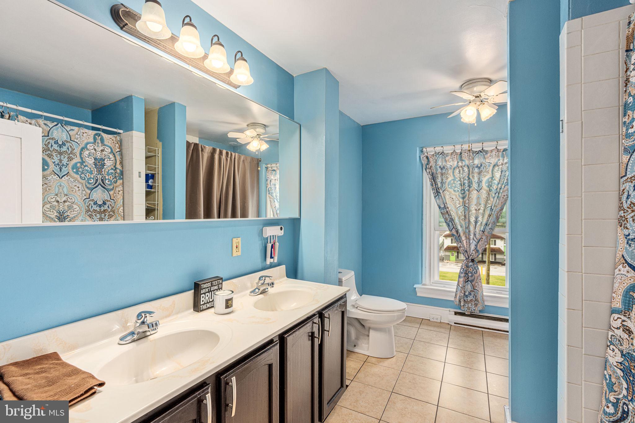 4701 Edges Mill Road Downingtown, PA 19335 - Photo 53 of 74 a en suite bathroom with a sink a mirror and a shower