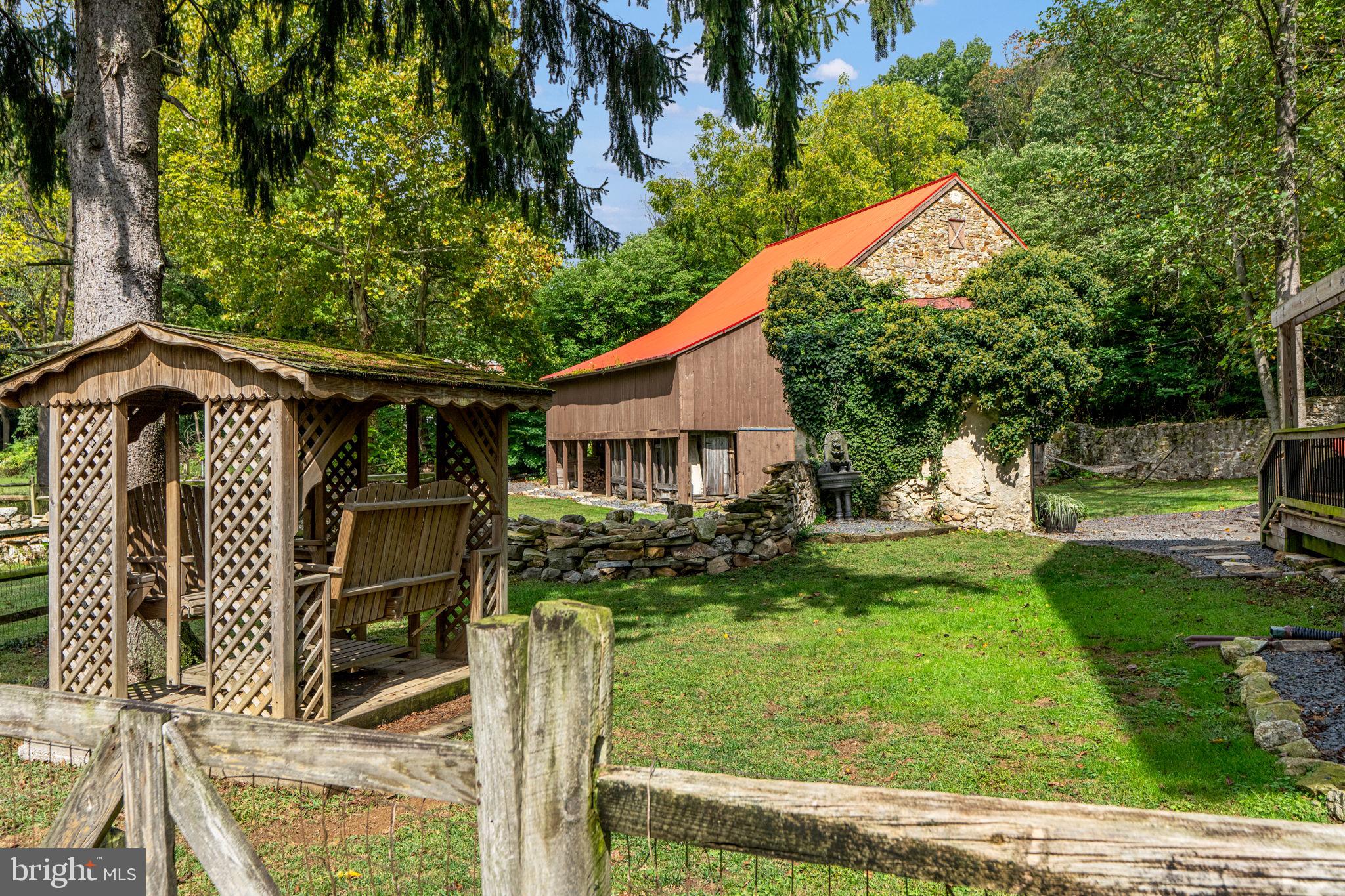 4701 Edges Mill Road Downingtown, PA 19335 - Photo 70 of 74 a front view of a house with garden