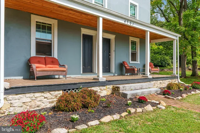 a view of a patio with a table and chairs