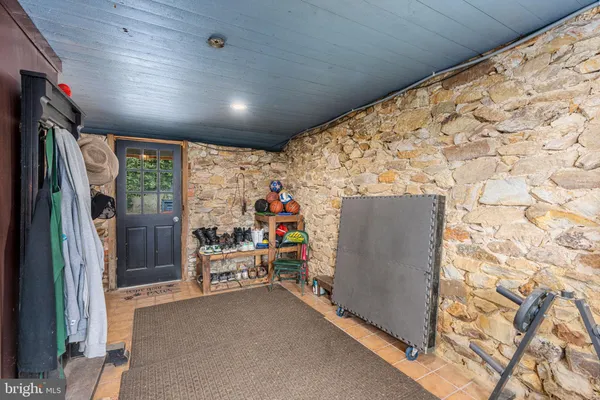 a open kitchen with stainless steel appliances granite countertop a stove a sink dishwasher and cabinets with wooden floor