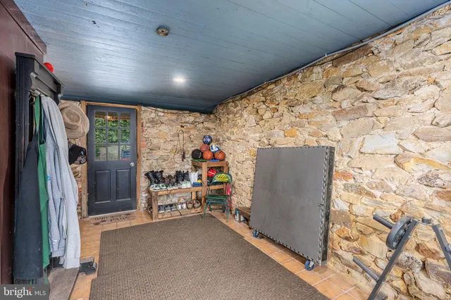 a open kitchen with stainless steel appliances granite countertop a stove a sink dishwasher and cabinets with wooden floor