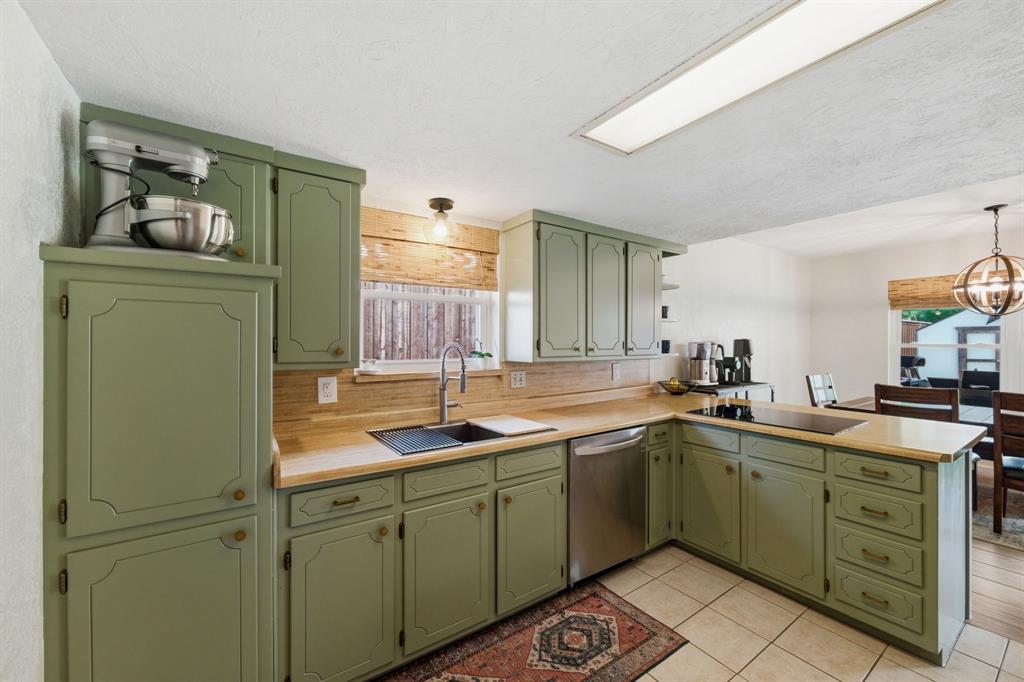 224 Overcrest Drive Benbrook, TX 76126 - Photo 14 of 39 a kitchen with a sink and cabinets