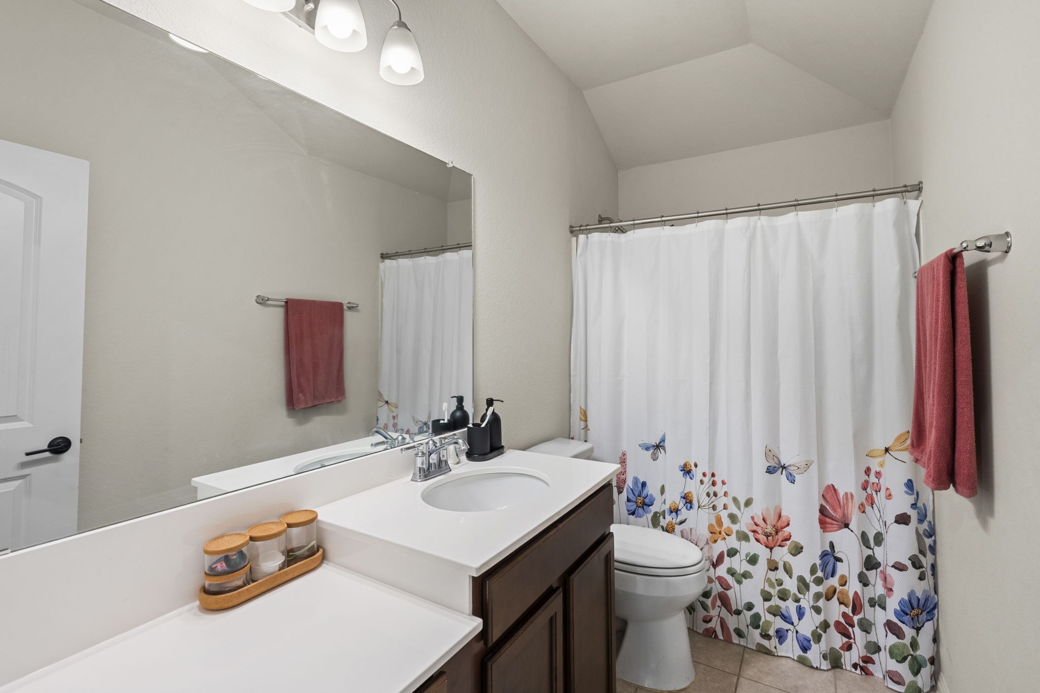 548 Purple Heart Drive Buda, TX 78610 - Photo 20 of 35 The crisp white vanity with a single basin offers ample counter space for daily routines.