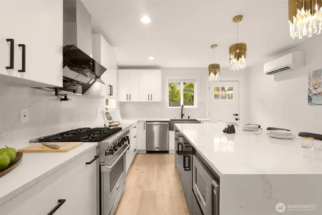 a kitchen with a sink a stove and cabinets