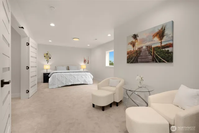 a bedroom with a bed and a couch