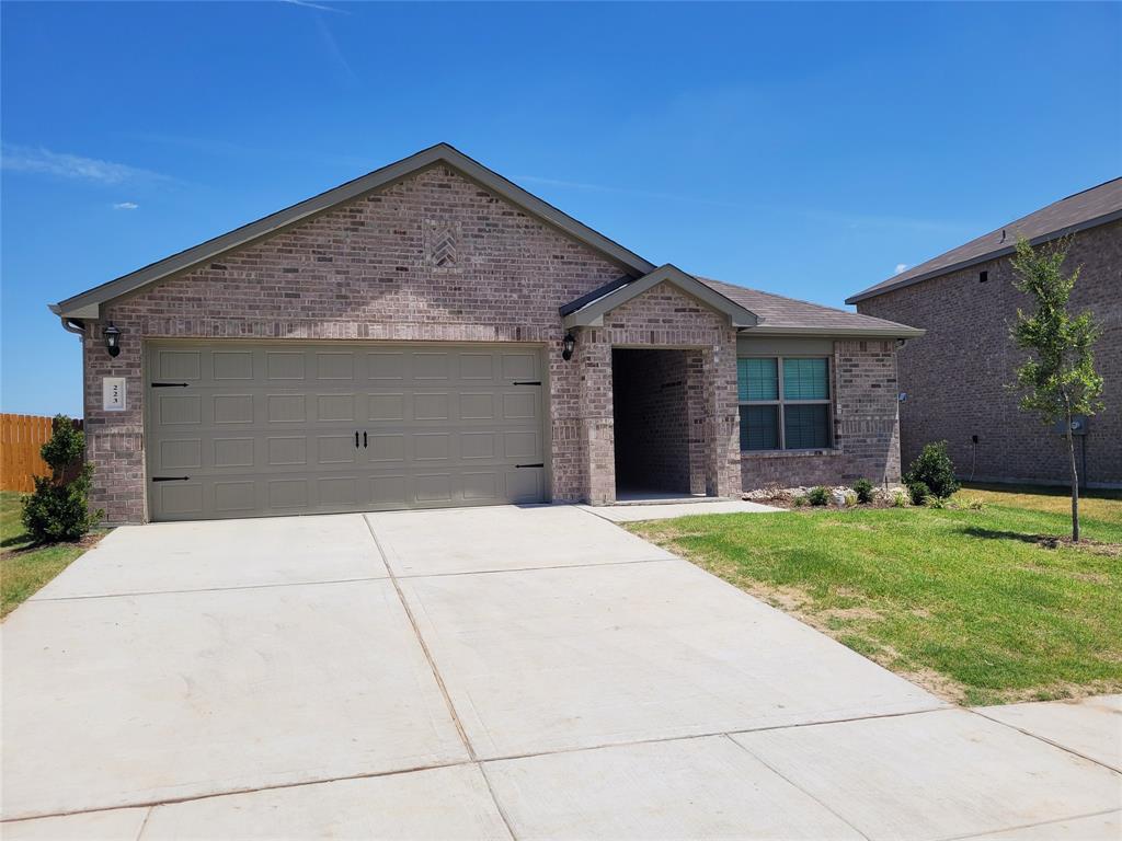 Ranch-style house with brick siding, driveway, a garage, and a front lawn