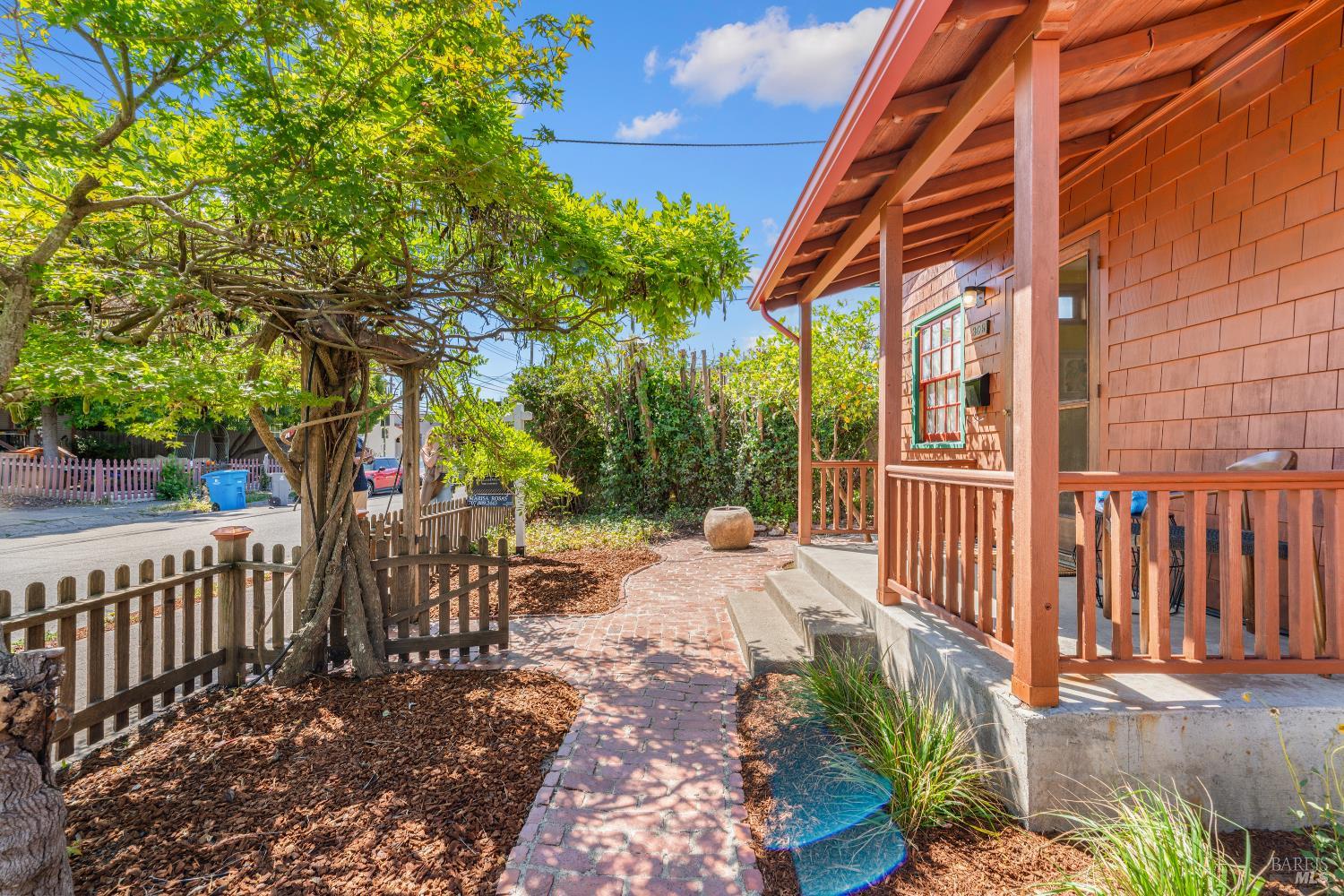 309 Hendley Street Santa Rosa, CA 95404 - Photo 2 of 31 a view of a pathway of a house with wooden fence