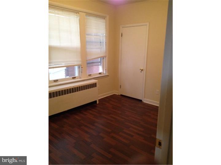 222 North Miller Street, Unit 1 Shillington, PA 19607 - Photo 3 of 5 a view of an empty room with wooden floor and a window