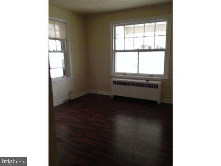 222 North Miller Street, Unit 1 Shillington, PA 19607 - Photo 4 of 5 a view of an empty room with wooden floor and a window
